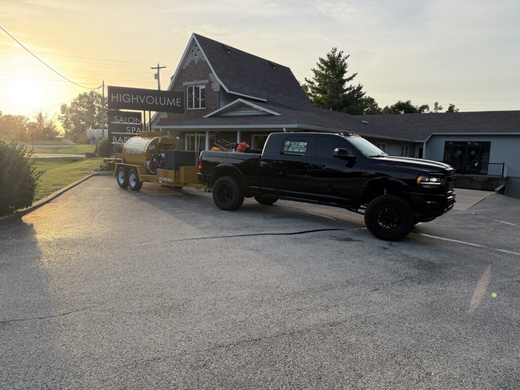 NextGen Pavement Solutions truck and sealcoating rig staged at High Volume Salon