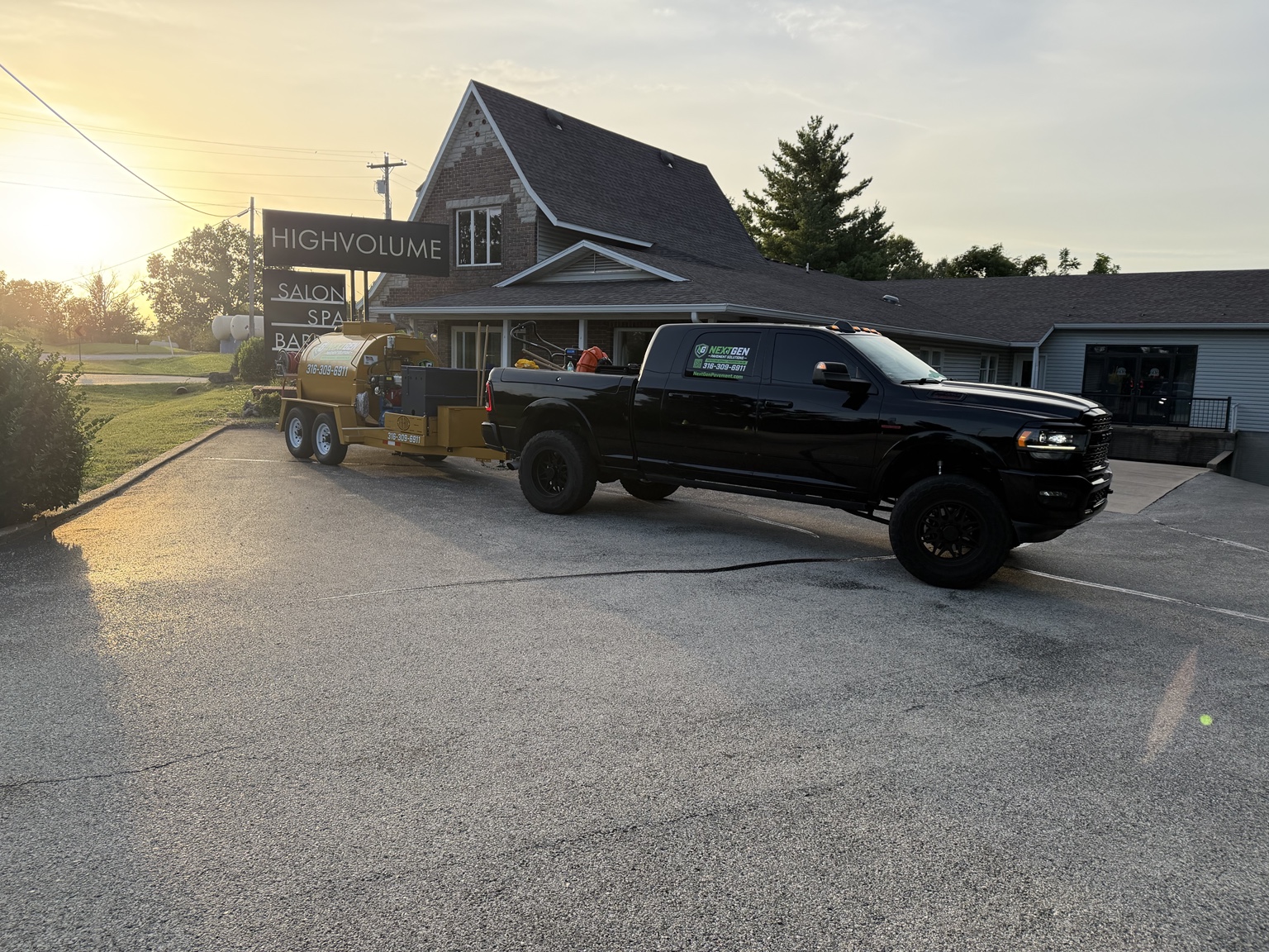 NextGen Pavement Solutions truck and sealcoating rig at High Volume Salon