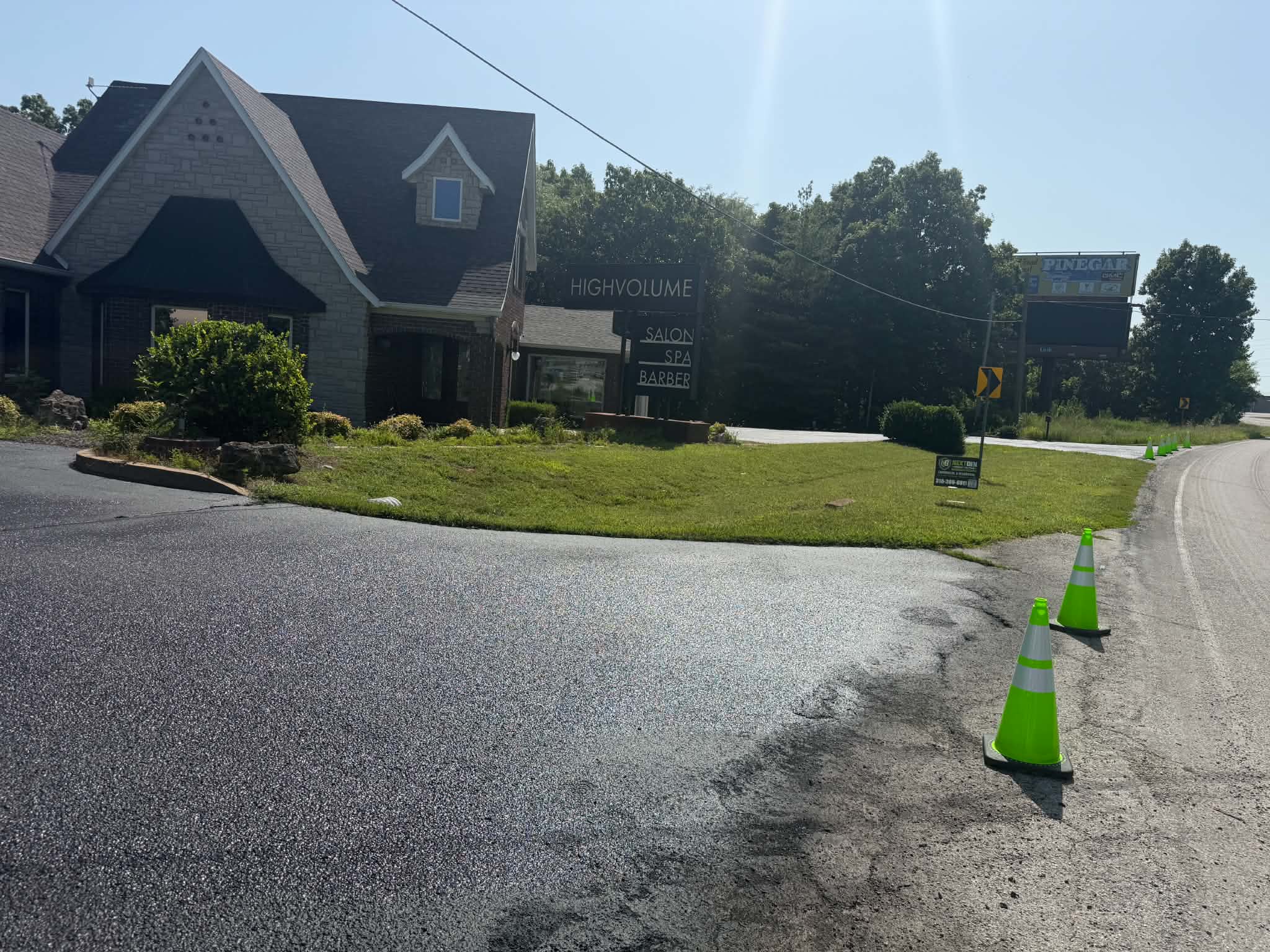 Clean Edges and Controlled Commercial Sealcoating High Volume Salon commercial pavement section completed with traffic cones