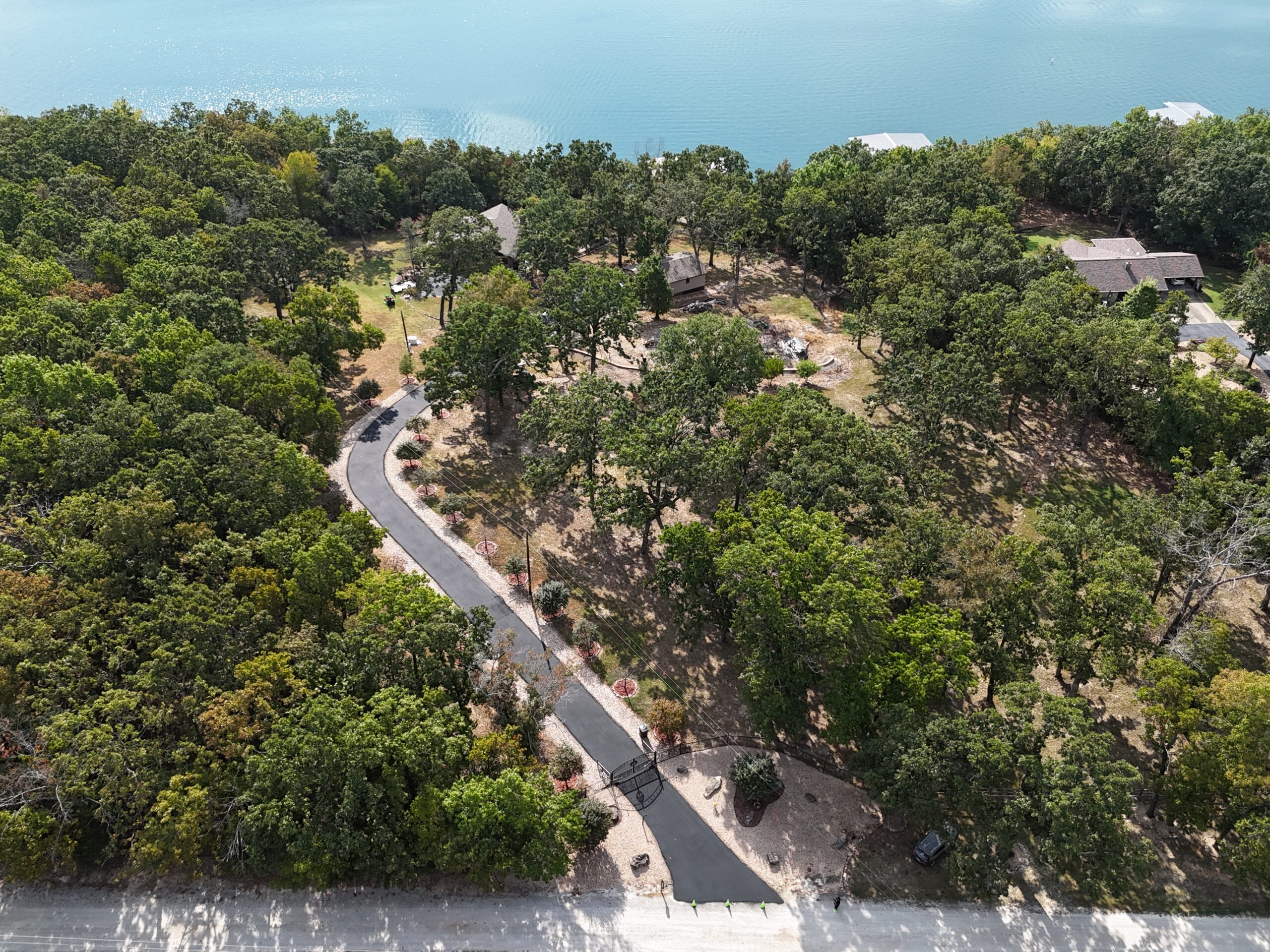 Aerial view of the finished curved driveway and surrounding property in Lampe