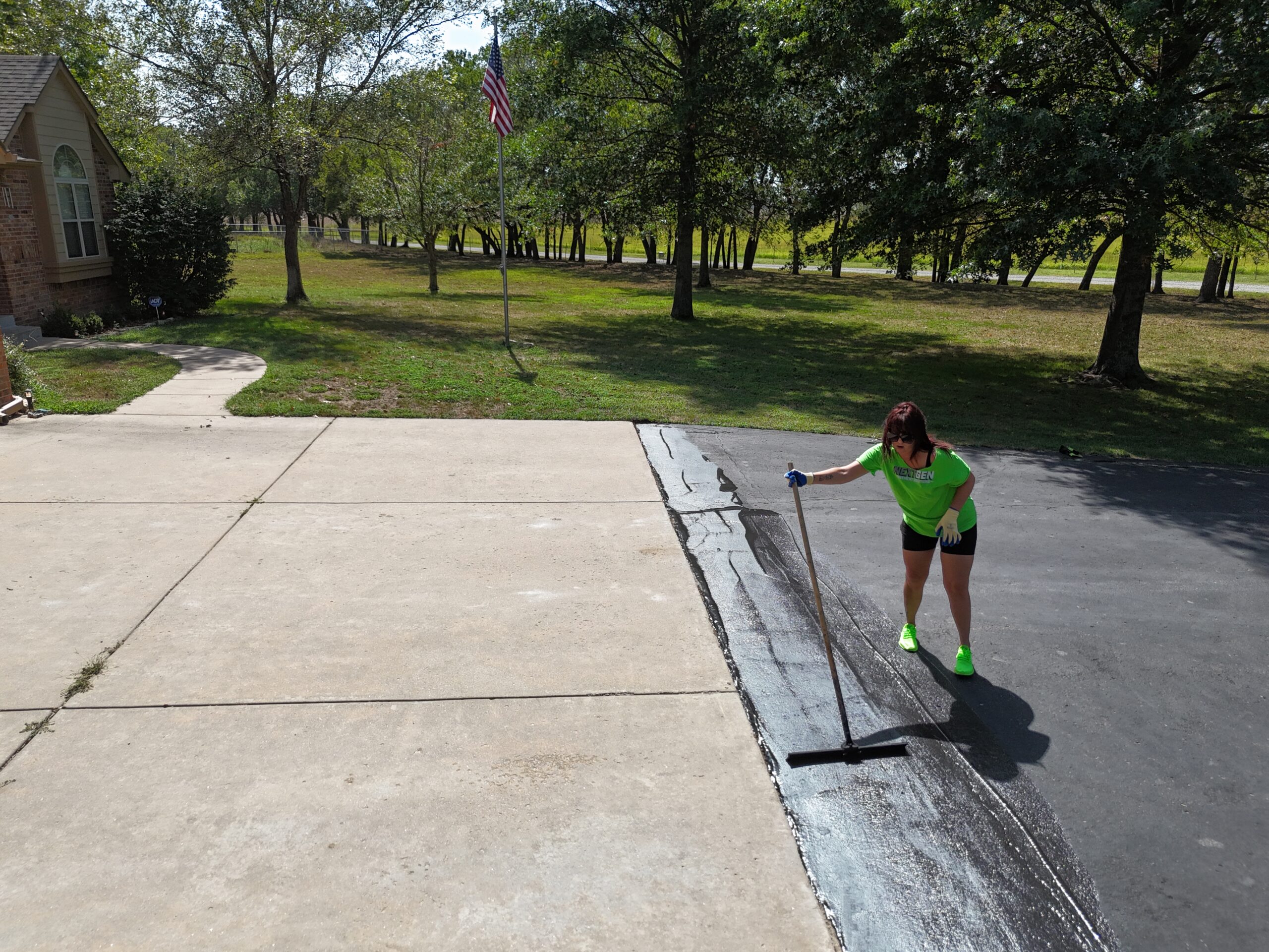 NextGen crew applying sealcoat to the El Dorado residential driveway