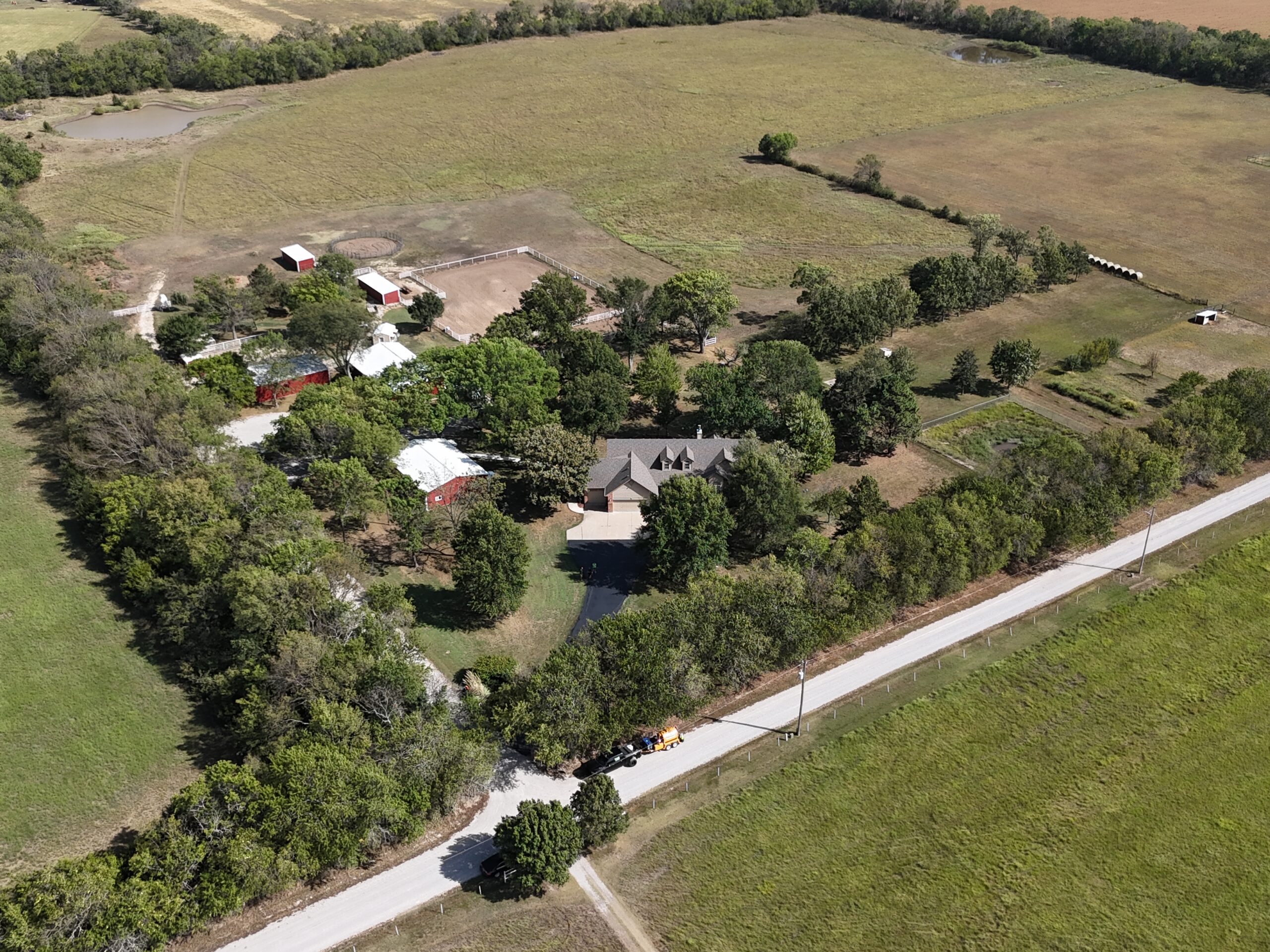 Wide aerial of the finished El Dorado driveway and surrounding Kansas property