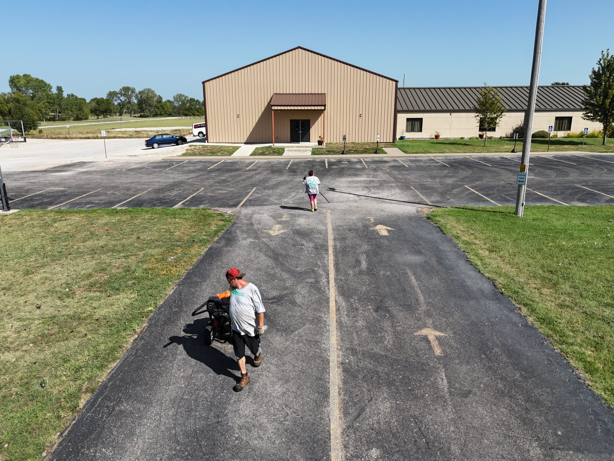 NextGen crew preparing and cleaning the Freedom Church parking-lot entrance in Augusta, Kansas
