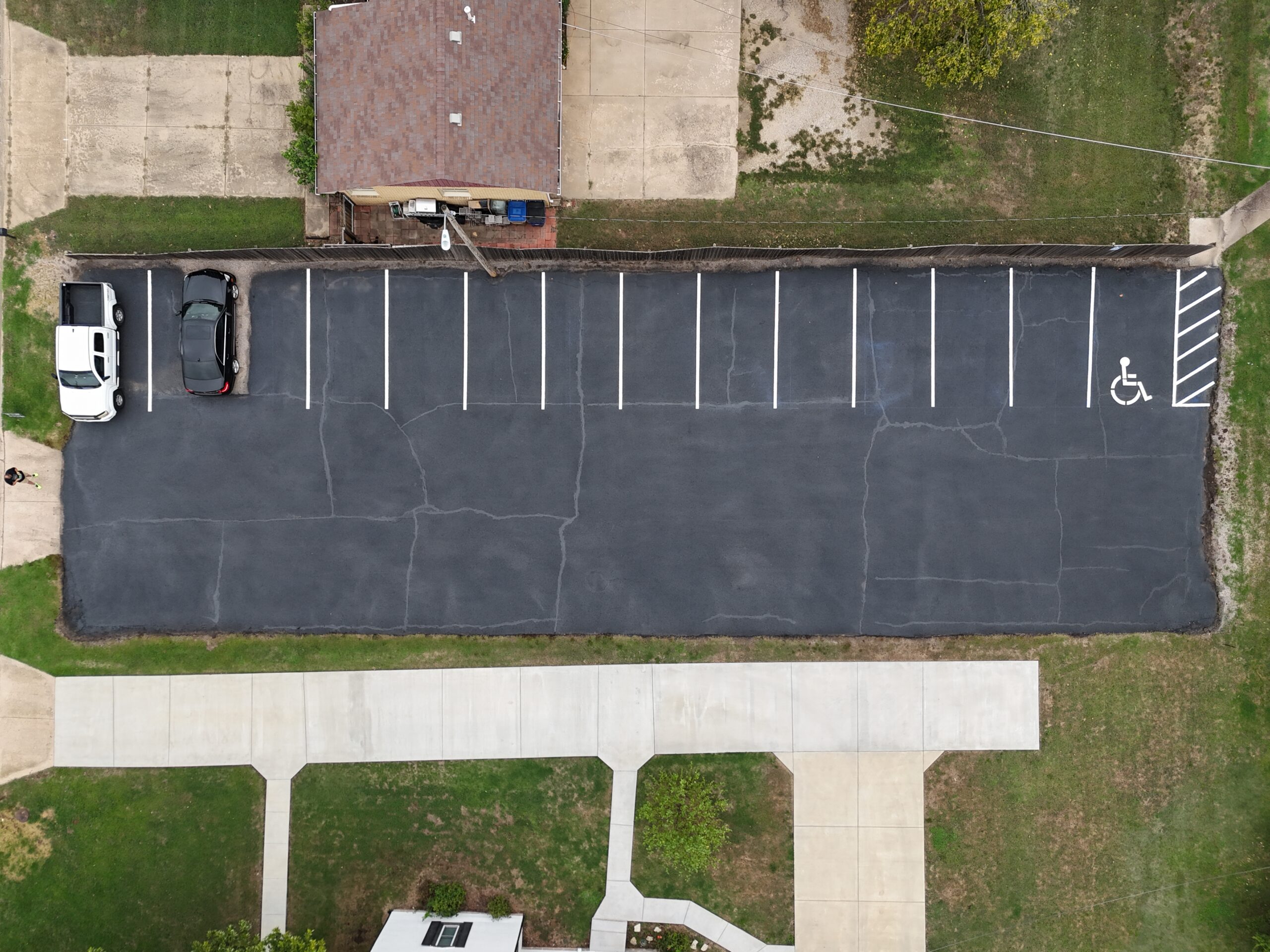 Finished striped parking lot at Grace Communion Derby in Derby, Kansas, viewed from above.
