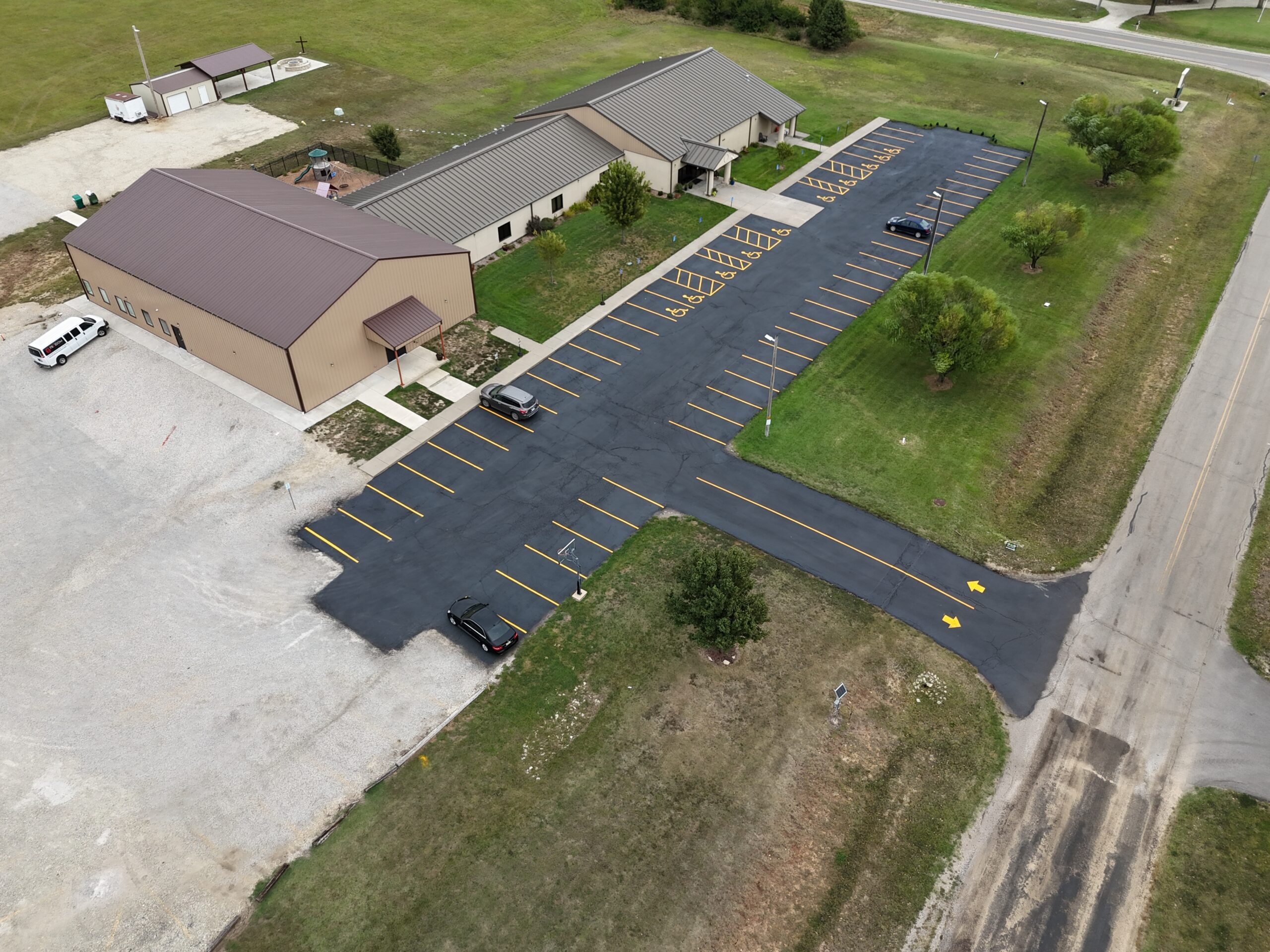 September 21 aerial of the completed Freedom Church parking lot in Augusta, Kansas, with fresh sealcoat and yellow parking lines