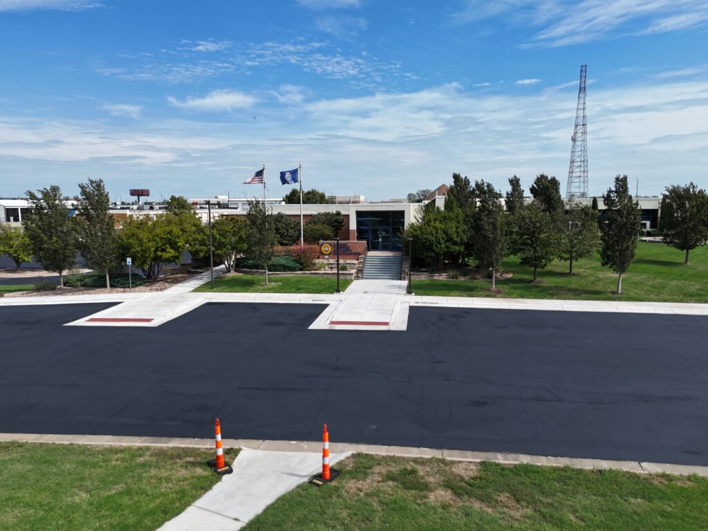 KTA Wichita Headquarters Sealcoating Freshly sealcoated parking area outside KTA Wichita headquarters on September 26 before KTA's planned striping