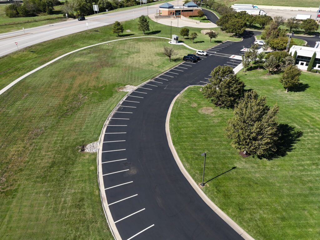 KTA Wichita Headquarters Sealcoating Reverse aerial angle of the striped parking area around KTA Wichita headquarters.