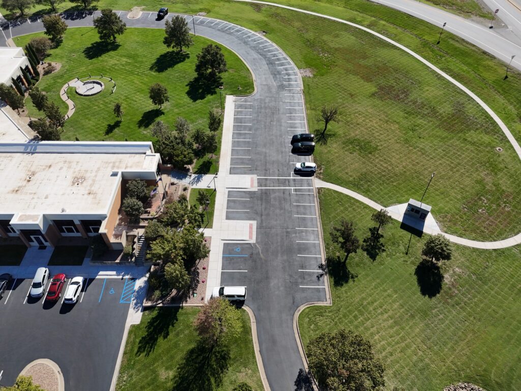 KTA Wichita Headquarters Sealcoating High aerial overview of KTA Wichita headquarters with the marked parking areas and surrounding grounds.