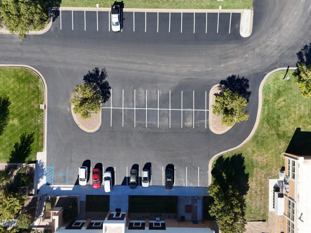 KTA Wichita Headquarters Sealcoating Overhead aerial view of the KTA headquarters courtyard and adjacent finished parking areas.