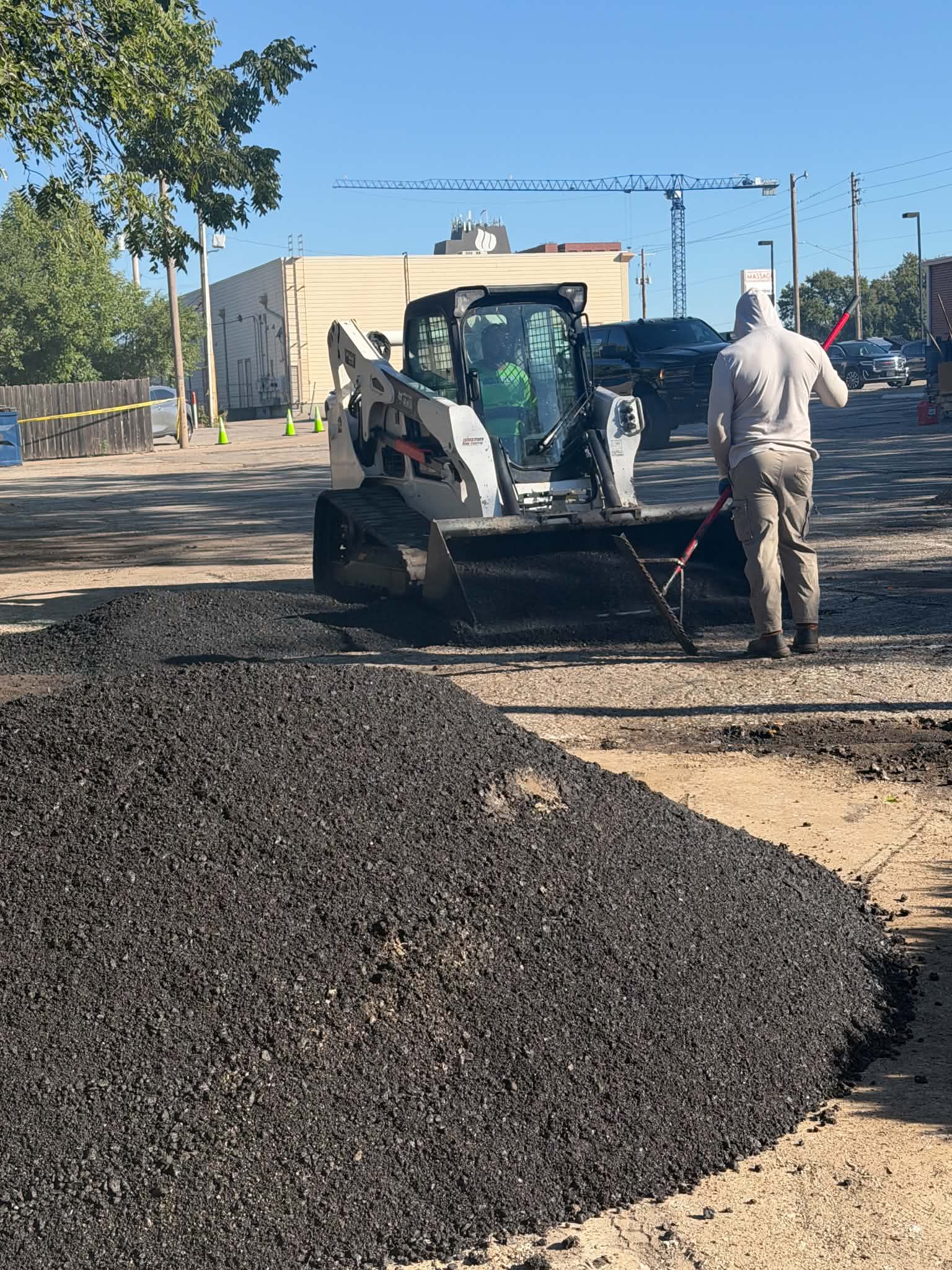 College Hill Pediatrics | Asphalt Repair & Sealcoating in Wichita Asphalt material being placed in a repair area at College Hill Pediatrics